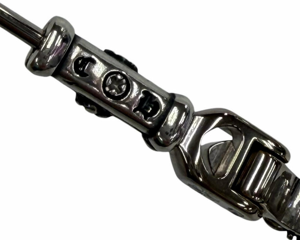 Close-up of a silver chain bracelet on a white background