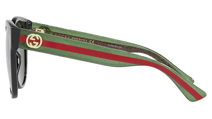 Sunglasses with green and red striped arms on a black background